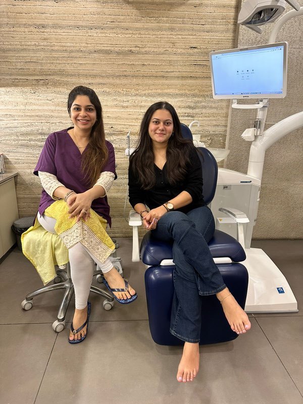 Dr. Kaynat Gilani with a patient at Designer Dental